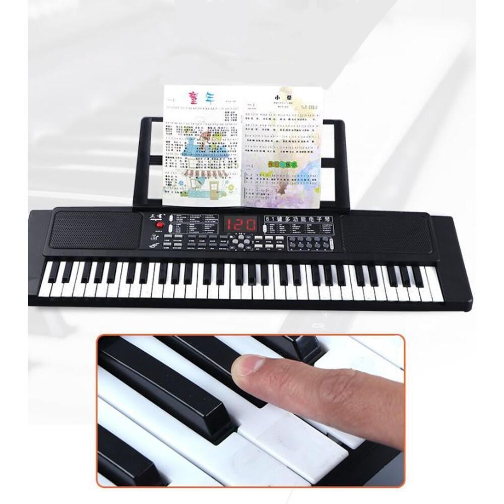 Encontraproduto.com.br - TECLADO PIANO ELETRONICO 61 TECLAS COM PARTITURA PROFISSIONAL USB