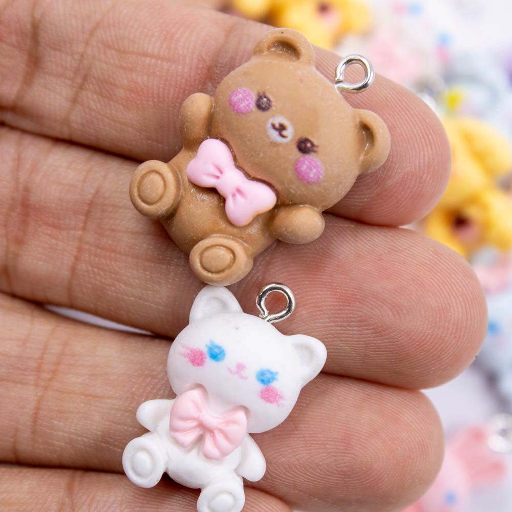 Encontraproduto.com.br - PINGENTE URSINHOS COM LAÇO 16X20MM EM RESINA COM 100 PEÇAS