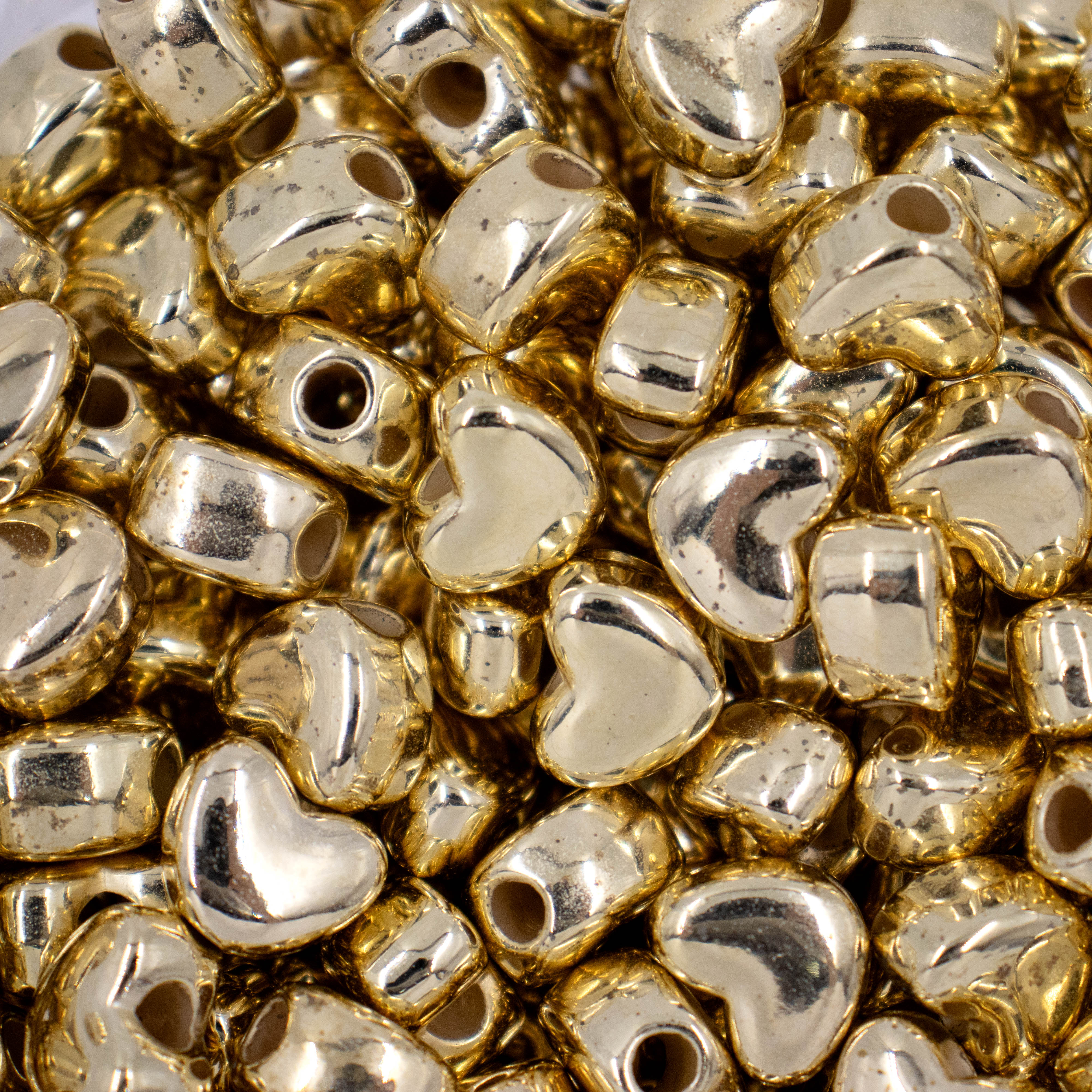 Encontraproduto.com.br - ENTREMEIO CORAÇAO LISO 12X14MM EM ABS COM 250GR