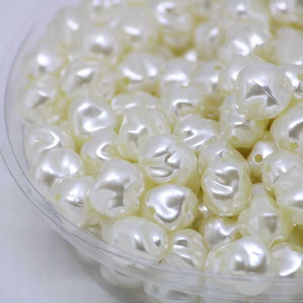 Encontraproduto.com.br - PEROLA IRREGULAR PASSANTE 10MM EM ABS COM 500GR